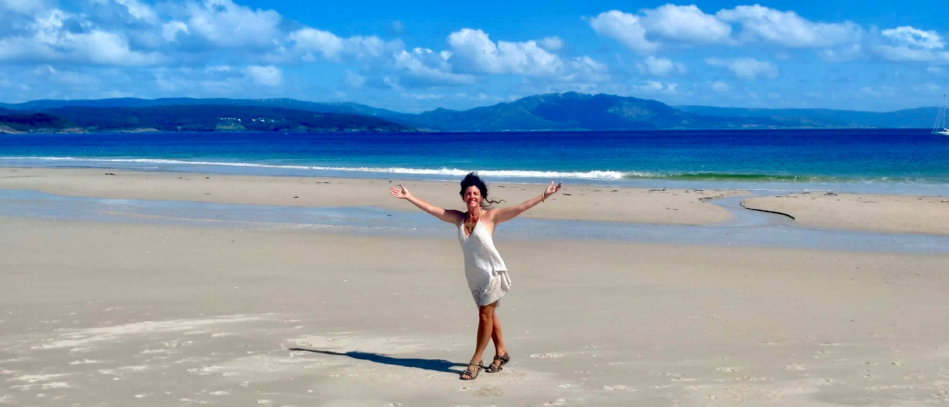 Natasha on an empty white sand beach